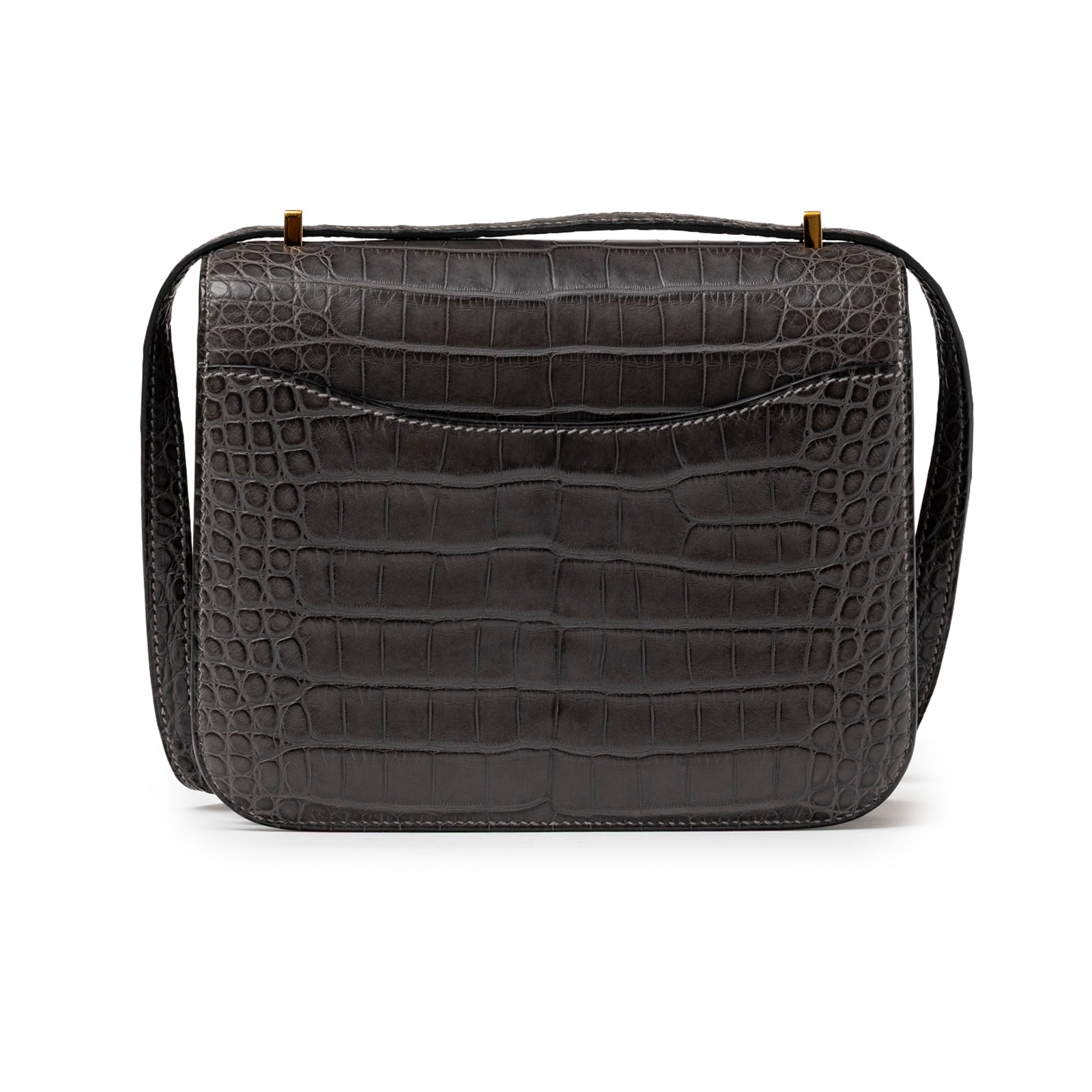 Back view of Hermès Mini Constance 18 Graphite Matte Alligator Gold Hardware showing textured alligator leather