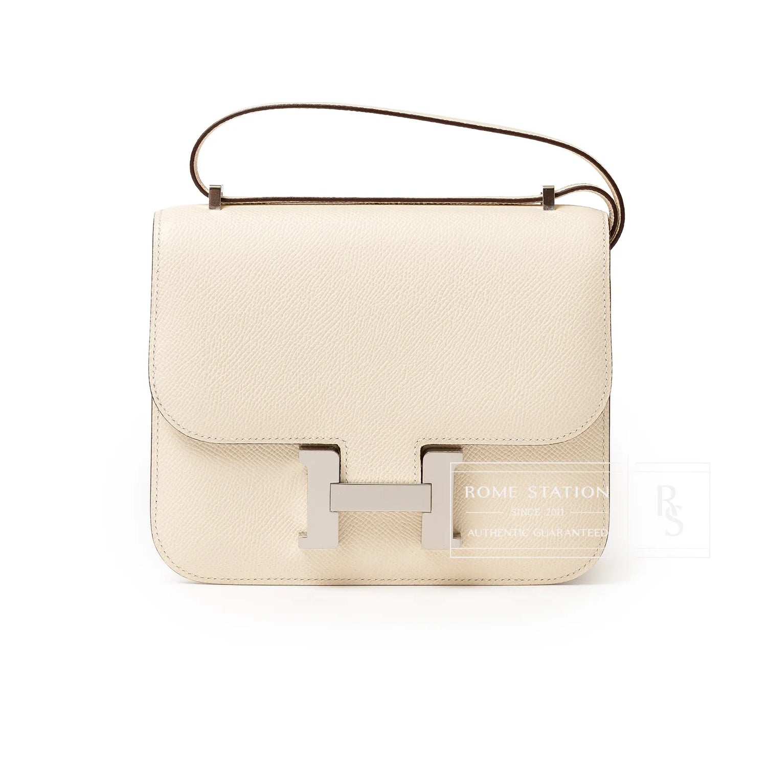 Front view of Hermès Mini Constance 18 Nata Epsom Palladium Hardware with smooth leather and silver clasp detail