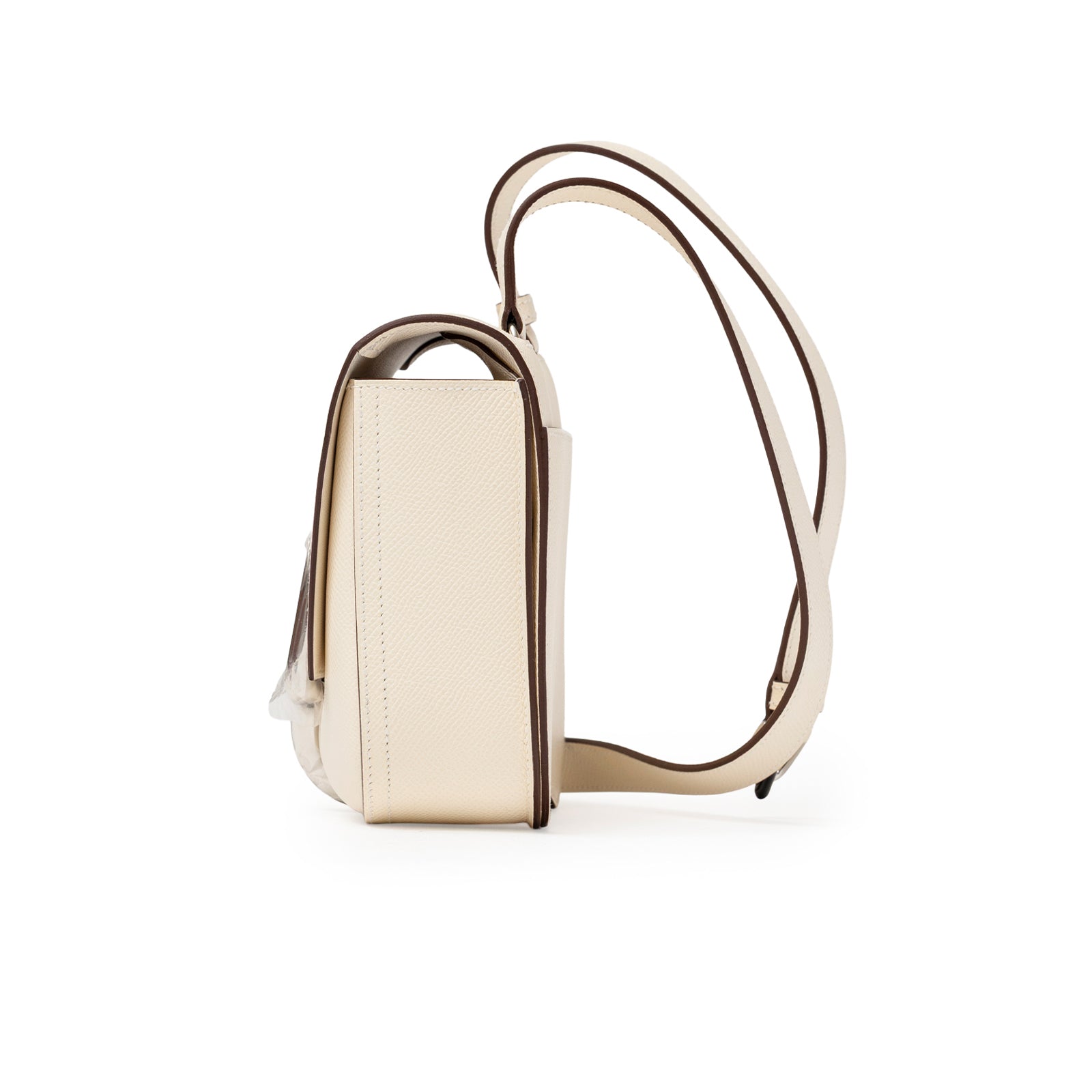 Side profile of Hermès Mini Della Cavalleria Craie Epsom Palladium Hardware showing cream leather and strap detail