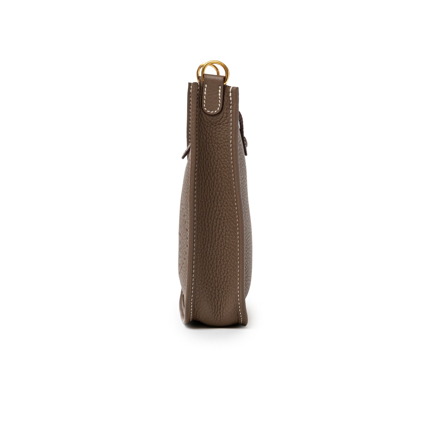 Side profile of Hermès Mini Evelyne Etoupe Blue Indigo Clemence Gold Hardware showing textured leather and stitching detail