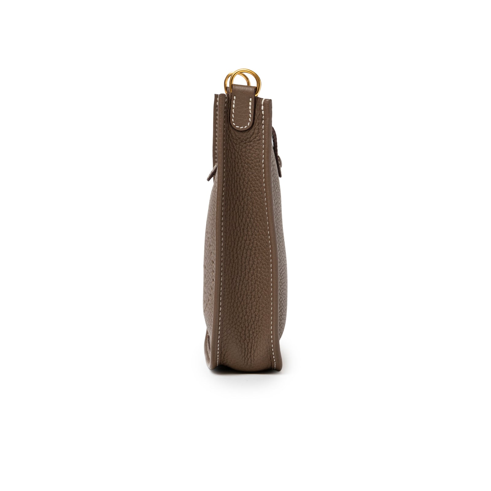 Side profile of Hermès Mini Evelyne Etoupe Blue Indigo Clemence Gold Hardware showing textured leather and stitching detail