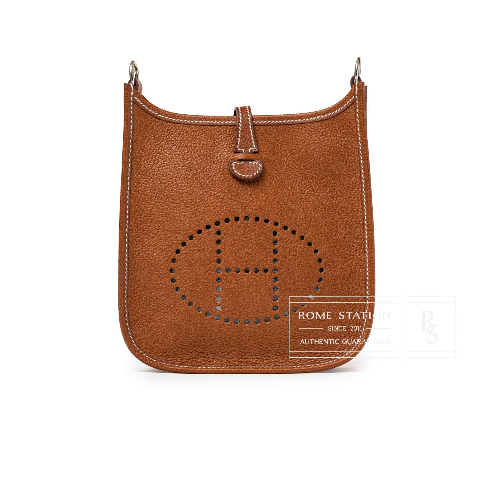 Front view of Hermès Mini Evelyne Fauve Barenia Palladium Hardware in tan leather with perforated H logo