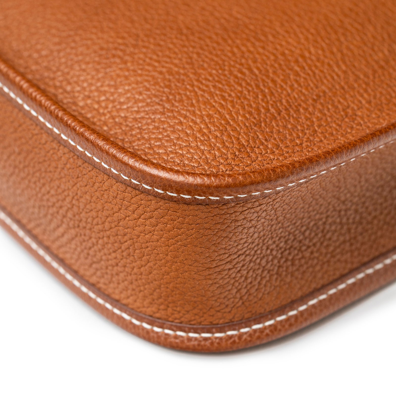 Close-up of corner stitching and textured leather on Hermès Mini Evelyne Fauve Barenia Palladium Hardware bag