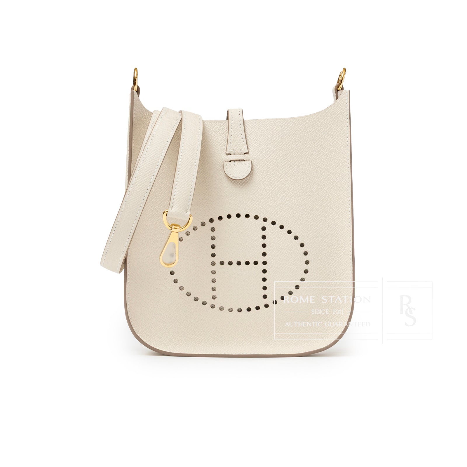 Front view of Hermès Mini Evelyne Sellier Craie Epsom Gold Hardware with perforated H logo and adjustable strap