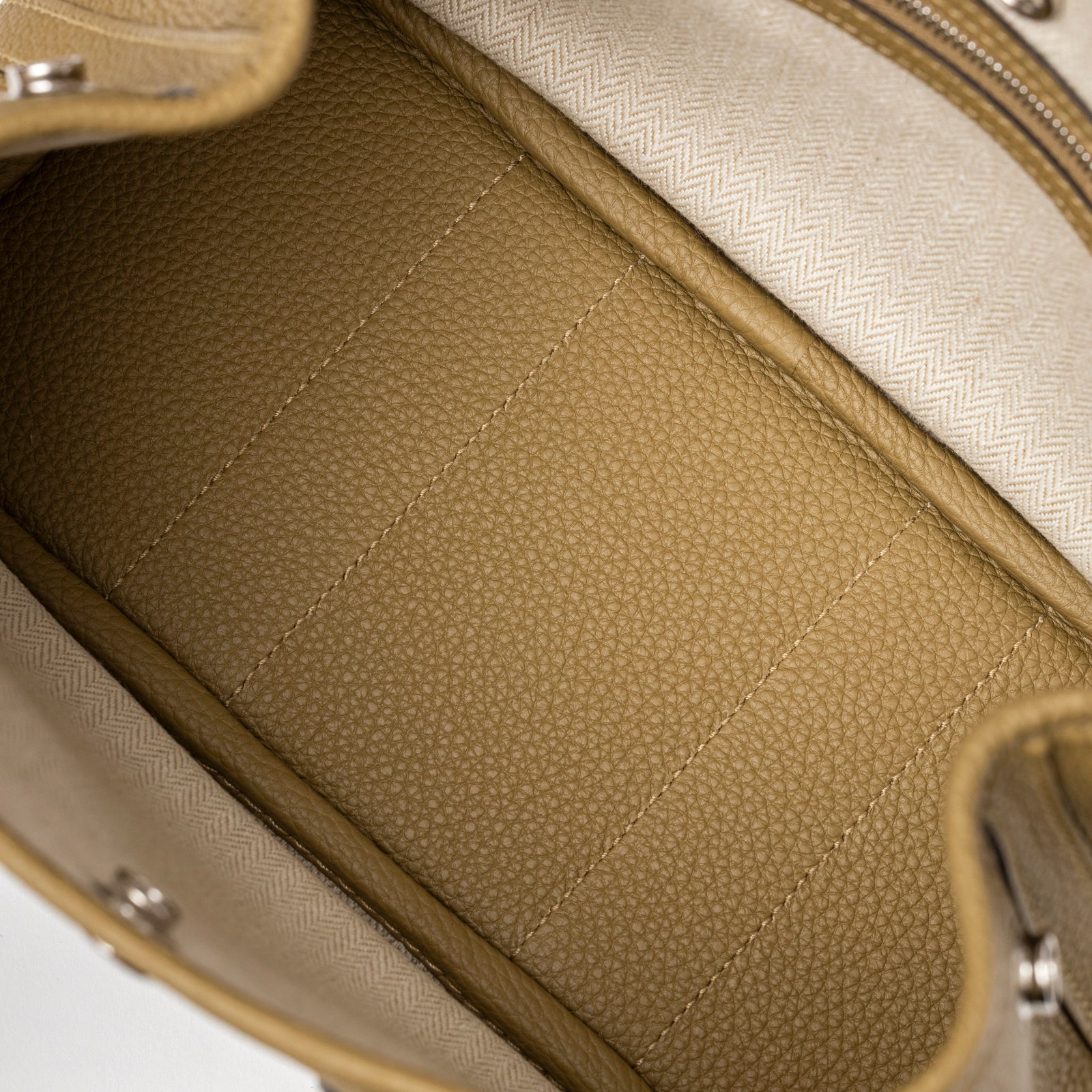 Inside view of Hermès Mini Garden Party Neo 23 Dune Negonda Palladium Hardware showing textured leather base and fabric lining