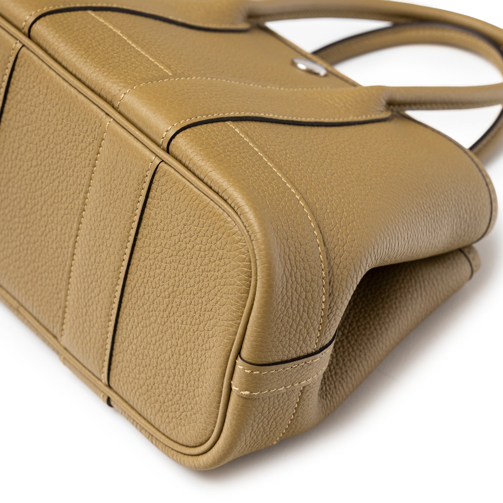 Close-up angled view of textured taupe leather and stitching details on Hermès Mini Garden Party Neo 23 Dune Negonda Palladium Hardware