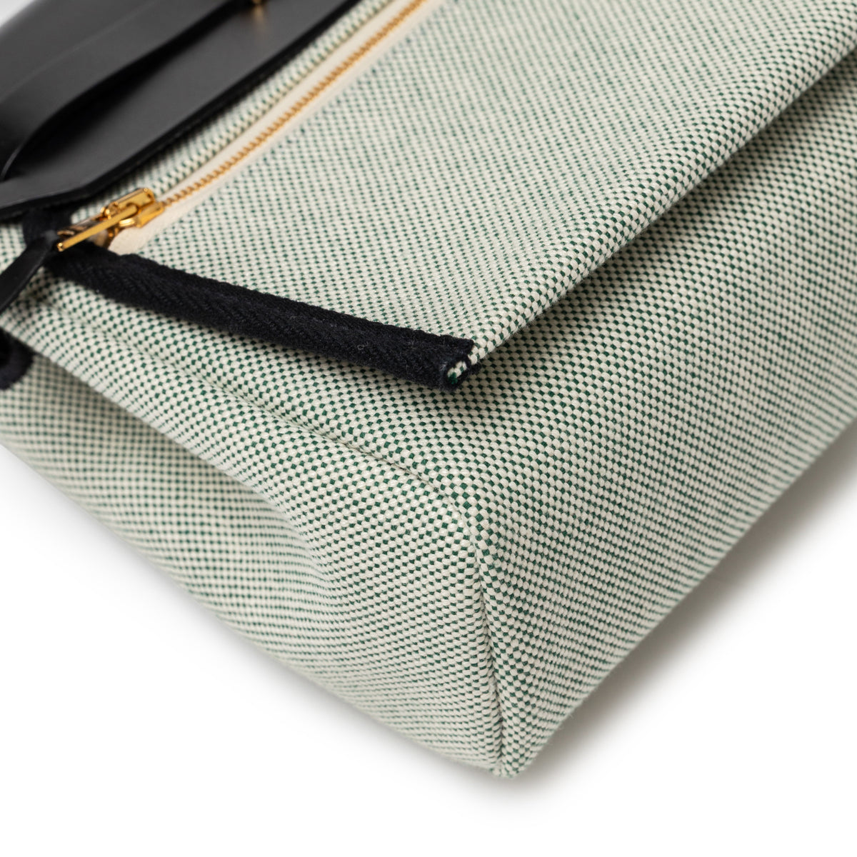 Hermès Mini Herbag Zip 20 Black Ecru Vert Moyen Toile Gold Hardware close up of toile corner and zip pocket