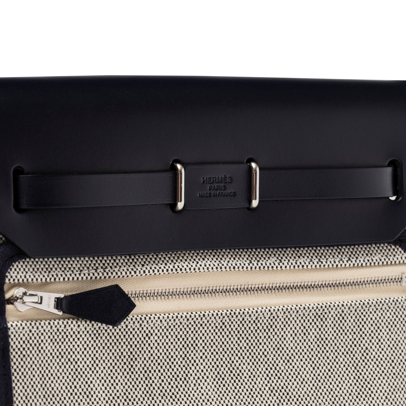 Close-up of Hermès Mini Herbag Zip 20 Ecru-Black Blue Indigo Toile and Vache Hunter Palladium Hardware zipper detail