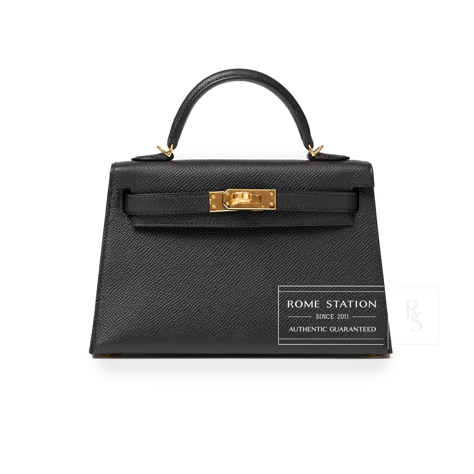 Front view of a black leather handbag with gold hardware and a top handle.