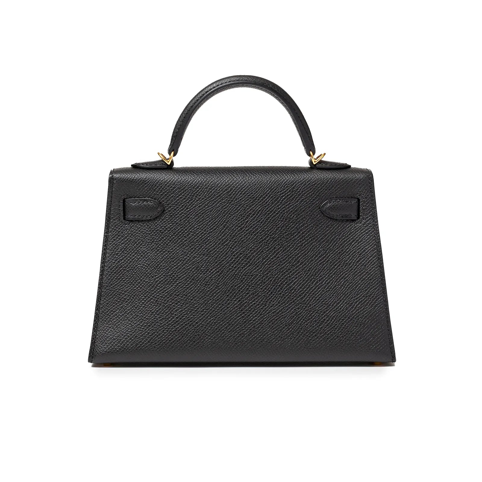 Back view of black textured handbag with gold hardware and top handle.