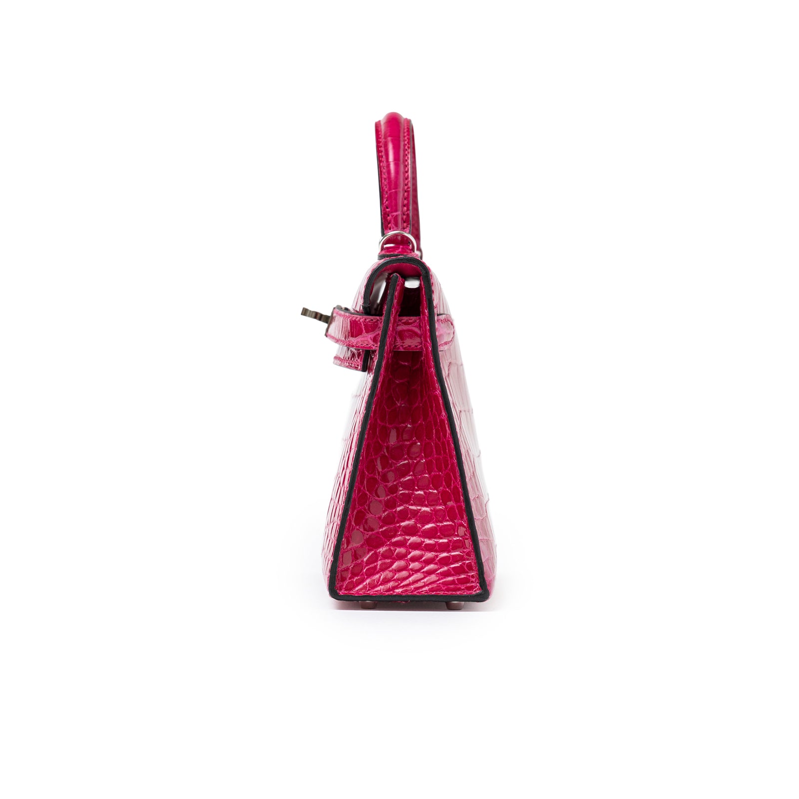 Side profile of Hermès Mini Kelly II Sellier 20 Rose Mexico Shiny Alligator Palladium Hardware showing textured side panel and handle details