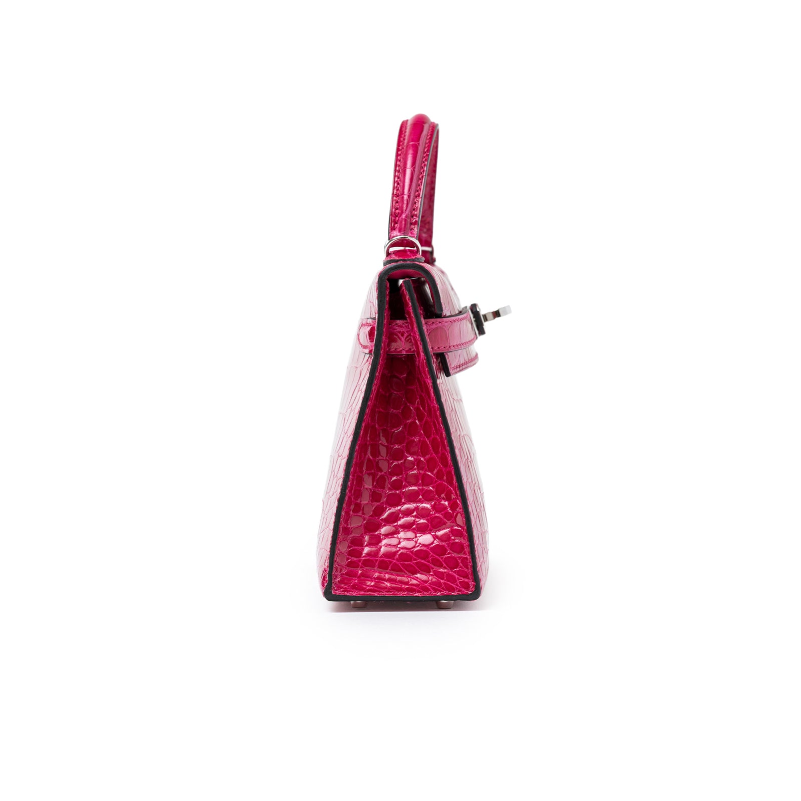 Side view of Hermès Mini Kelly II Sellier 20 Rose Mexico Shiny Alligator Palladium Hardware bag showing sleek profile and handle