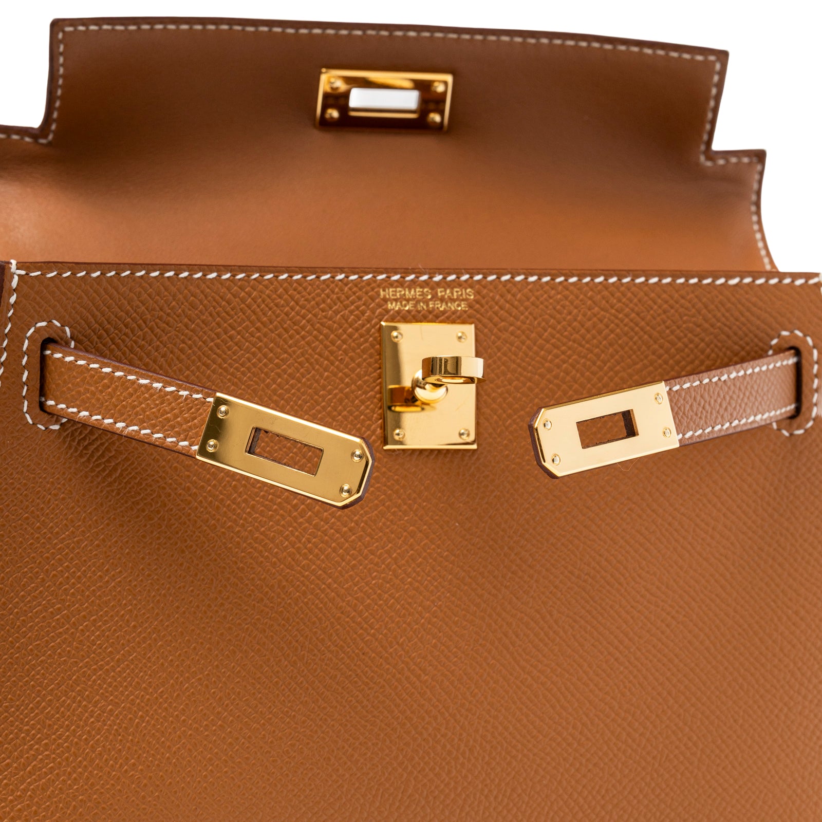 Close-up of Hermès Mini Kelly II Sellier Gold Epsom Gold Hardware showing clasp and leather stitching detail