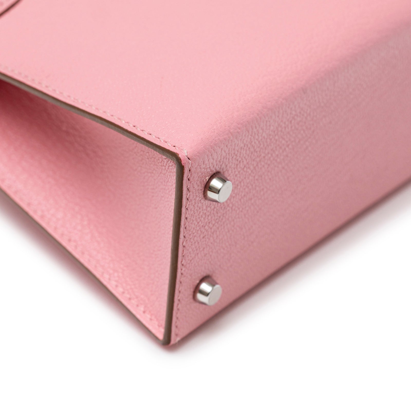 Close-up of Hermès Mini Kelly II Sellier Rose Confetti Chevre Mysore Palladium Hardware base corner with stitching detail