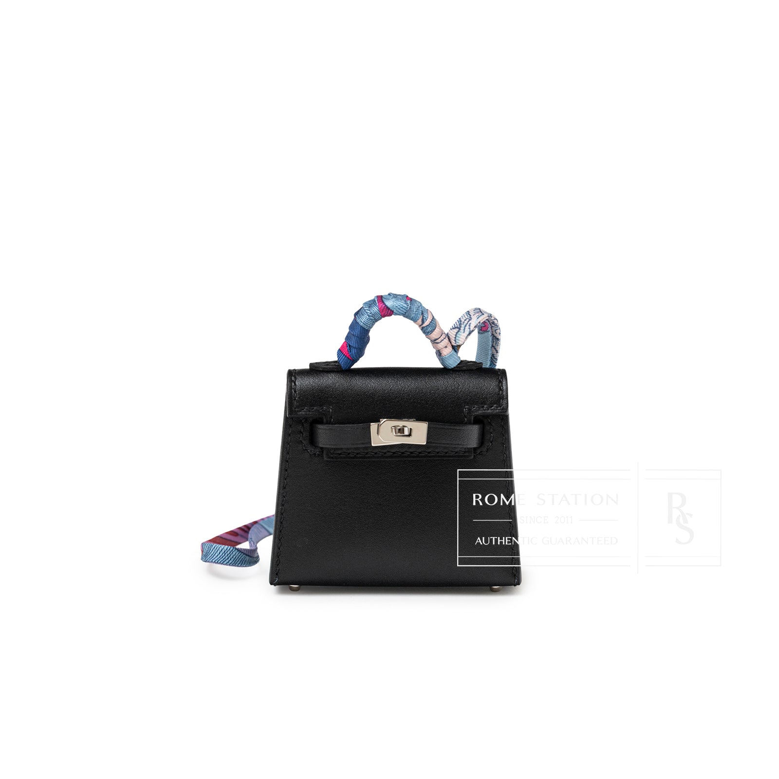 Front view of Hermès Mini Kelly Twilly Bag Charm Black Tadelakt with palladium hardware and colorful wrapped handle