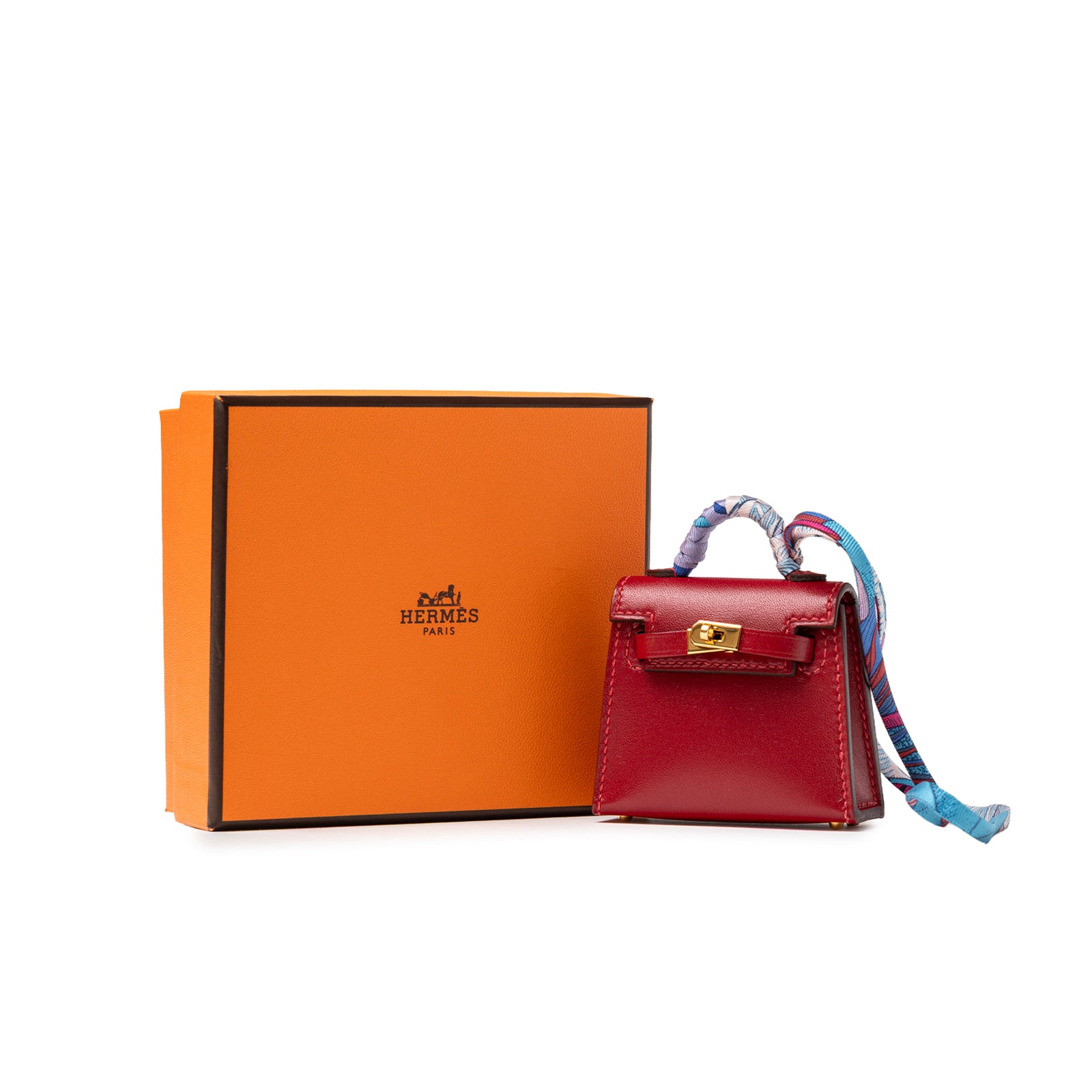Hermès Mini Kelly Twilly Bag Charm Rouge Tadelakt Gold Hardware with signature orange box and patterned twilly wrap