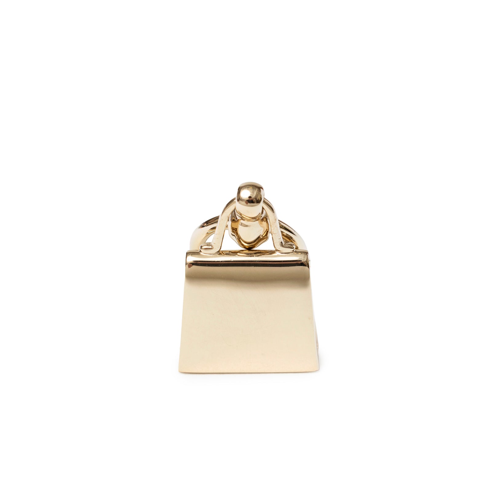 Back view of Hermès Mini Kelly Twilly Ring Permabrass Plated showing polished permabrass metal with handbag clasp detail