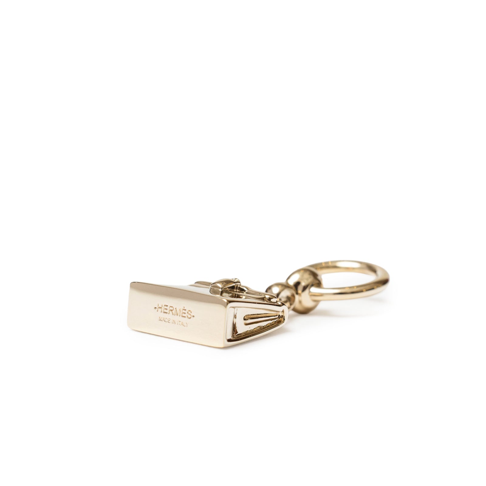 Close-up angled view of Hermès Mini Kelly Twilly Ring Permabrass Plated with engraved logo and polished finish