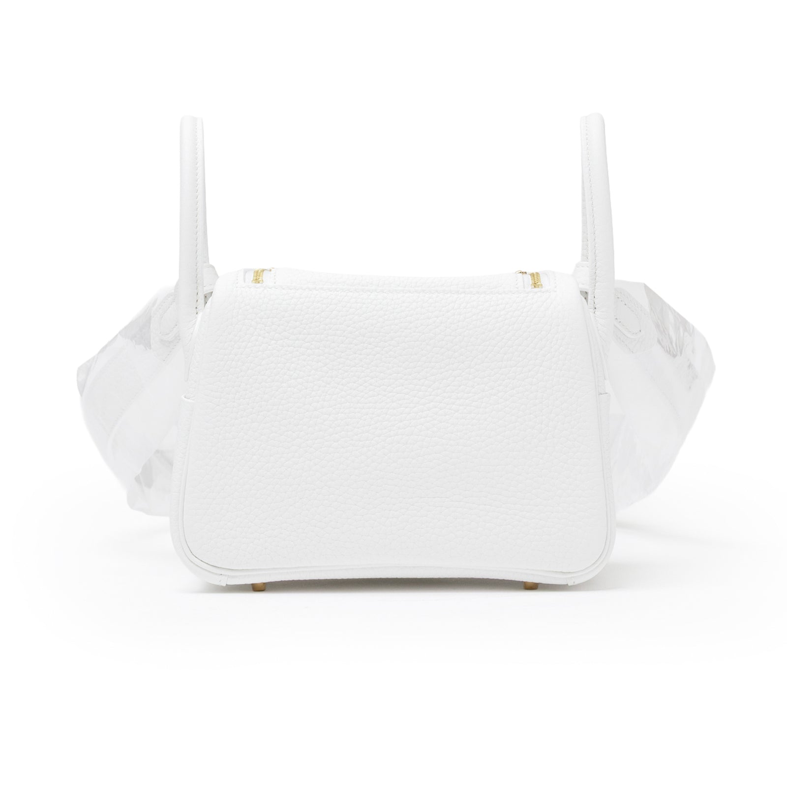 Back view of Hermès Mini Lindy II New White Clemence Gold Hardware showing textured leather and dual handles.