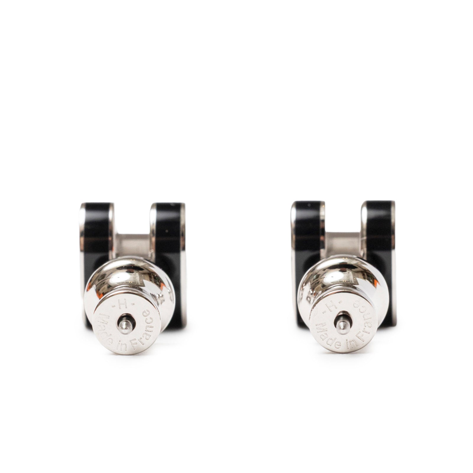 Back view of Hermès Mini Pop H Earrings Black Palladium Plated showcasing the black and silver details.