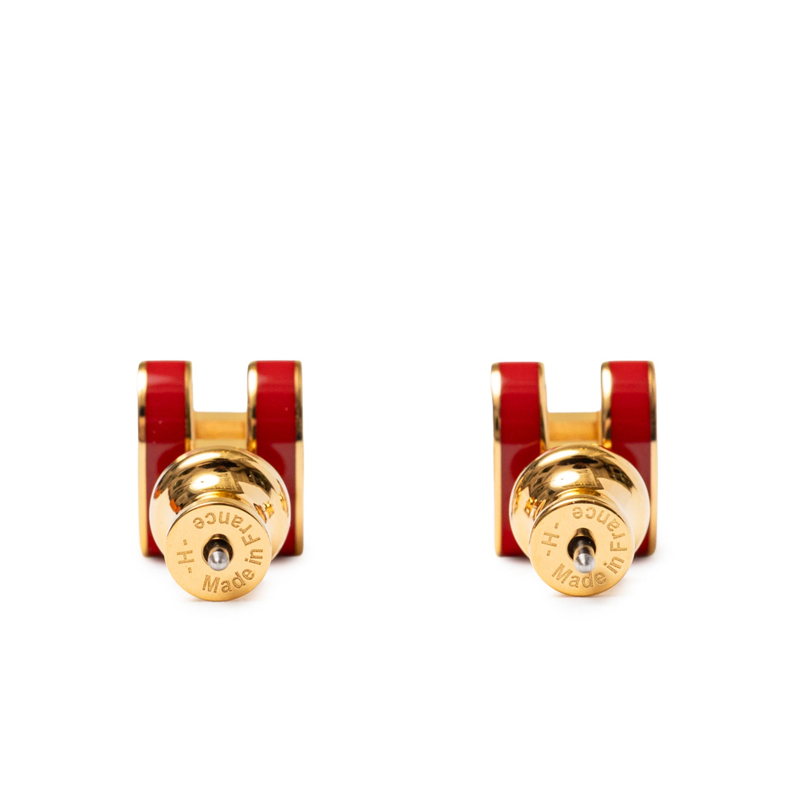 Close-up view of Hermès Mini Pop H Earrings Red Gold Plated showing the back clasps and red enamel detail