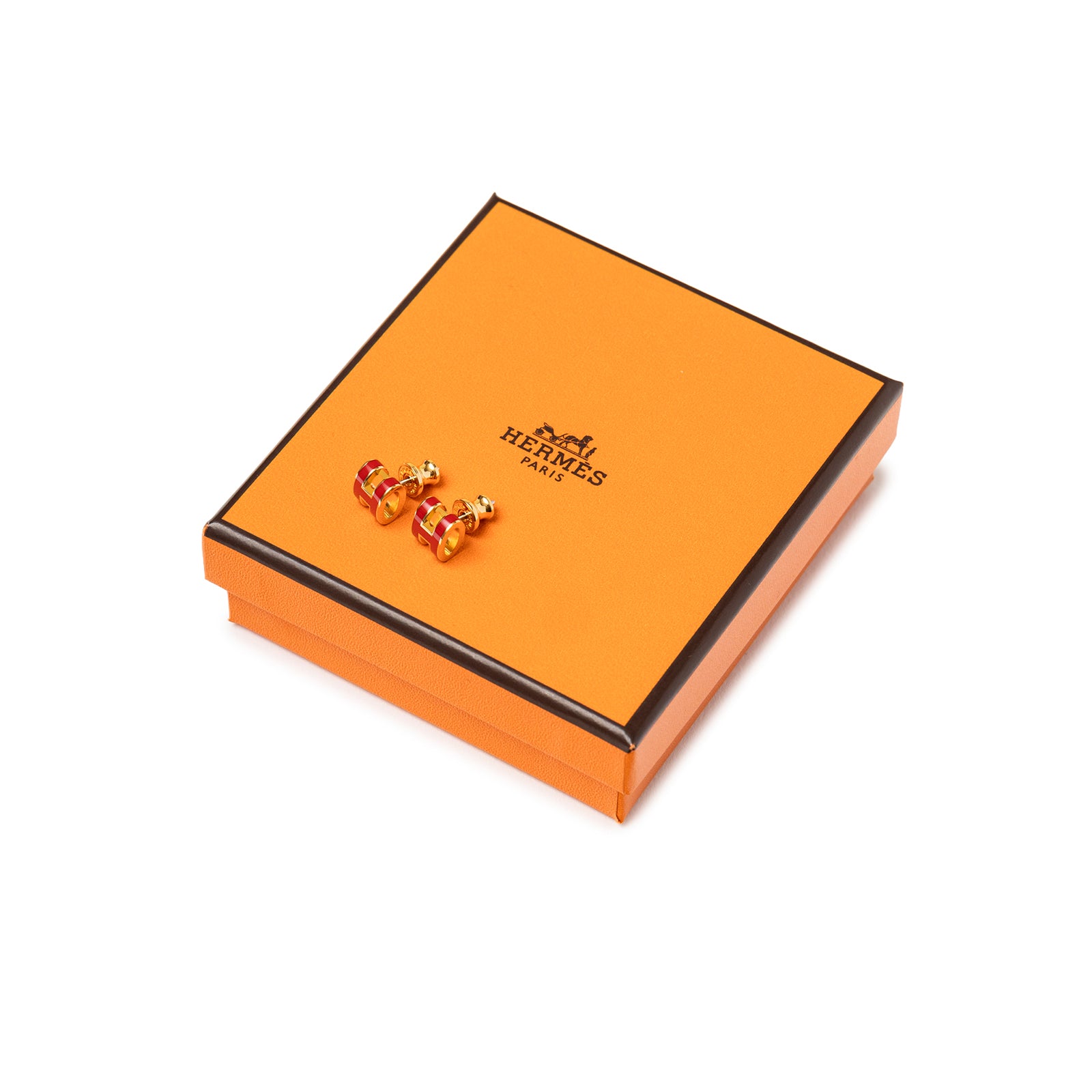Hermès Mini Pop H Earrings Red Gold Plated displayed on signature orange Hermès box, angled top-down view.