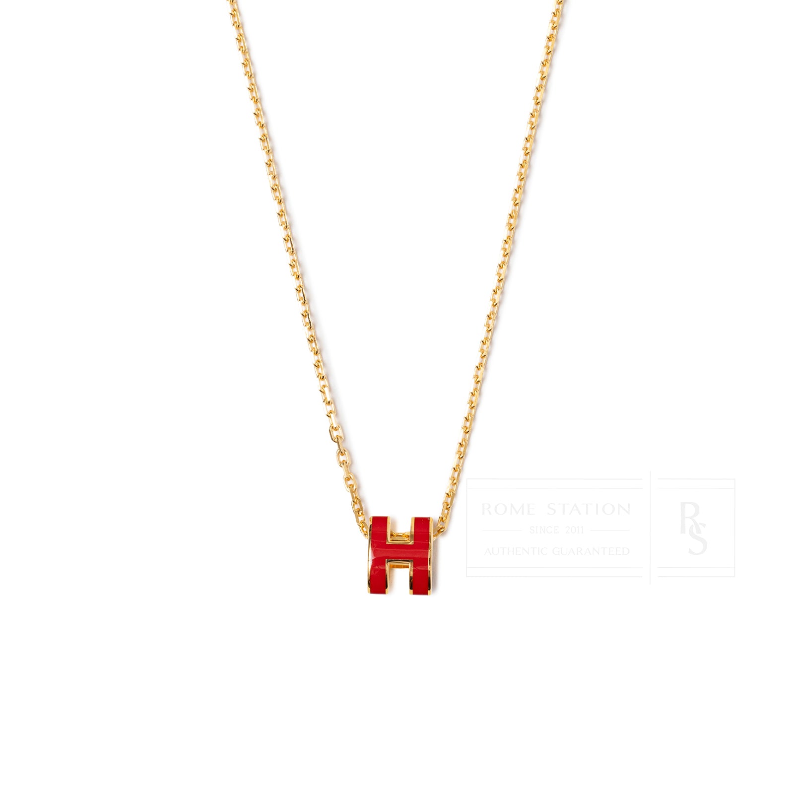 Front view of Hermès Mini Pop H Pendant Red Gold Plated with red enamel and delicate gold chain details.