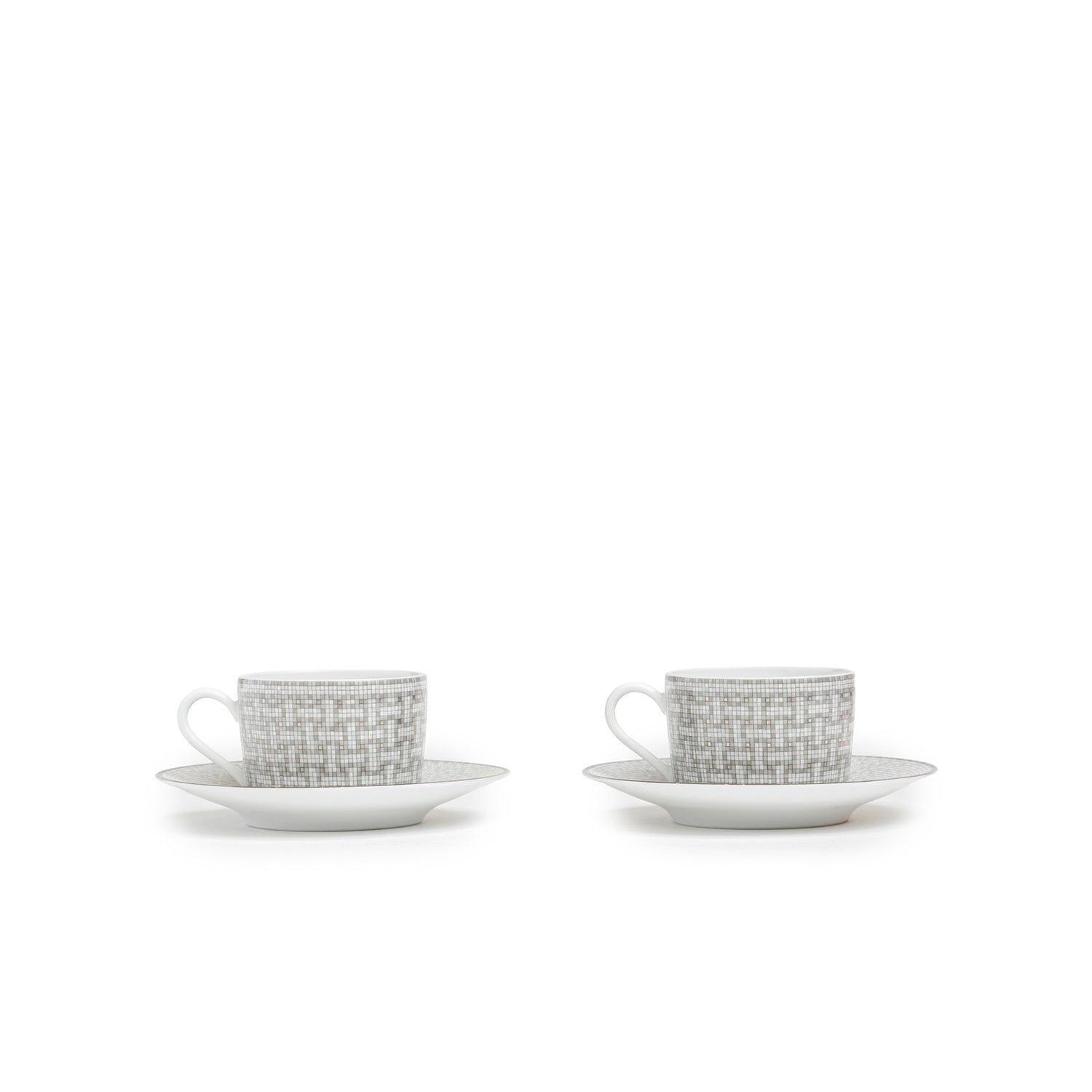 Front view of Hermès Mosaique au 24 Platinum Tea Cup & Saucer Set of Two with elegant geometric platinum patterning