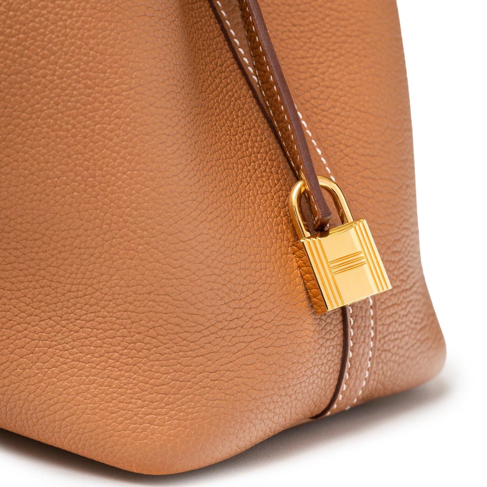 Close-up of Hermès Picotin 18 Gold Clemence Gold Hardware D corner showing soft leather texture and gold lock detail