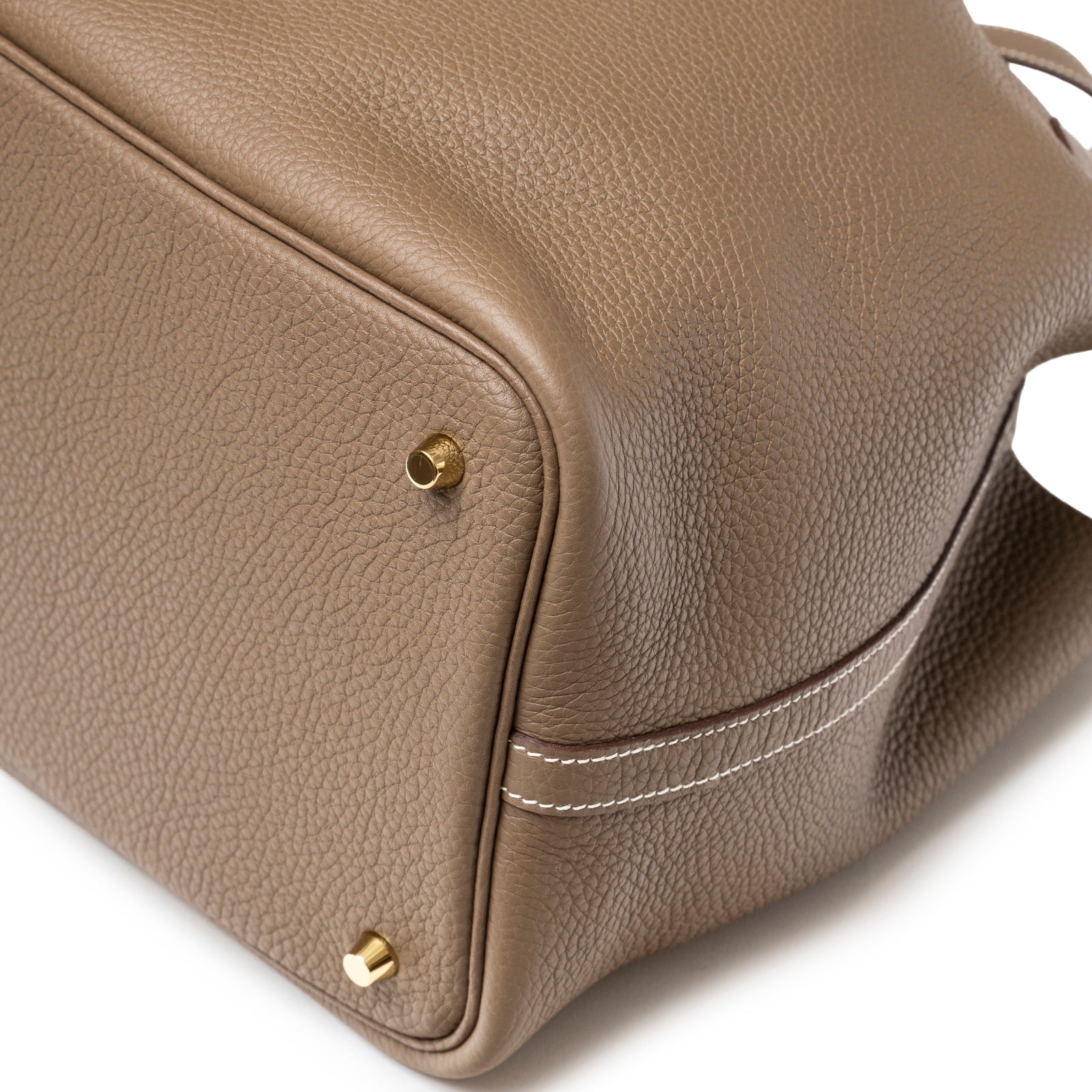 Close-up angled view of Hermès Picotin 22 Etoupe Clemence Gold Hardware showing textured leather and gold feet detail