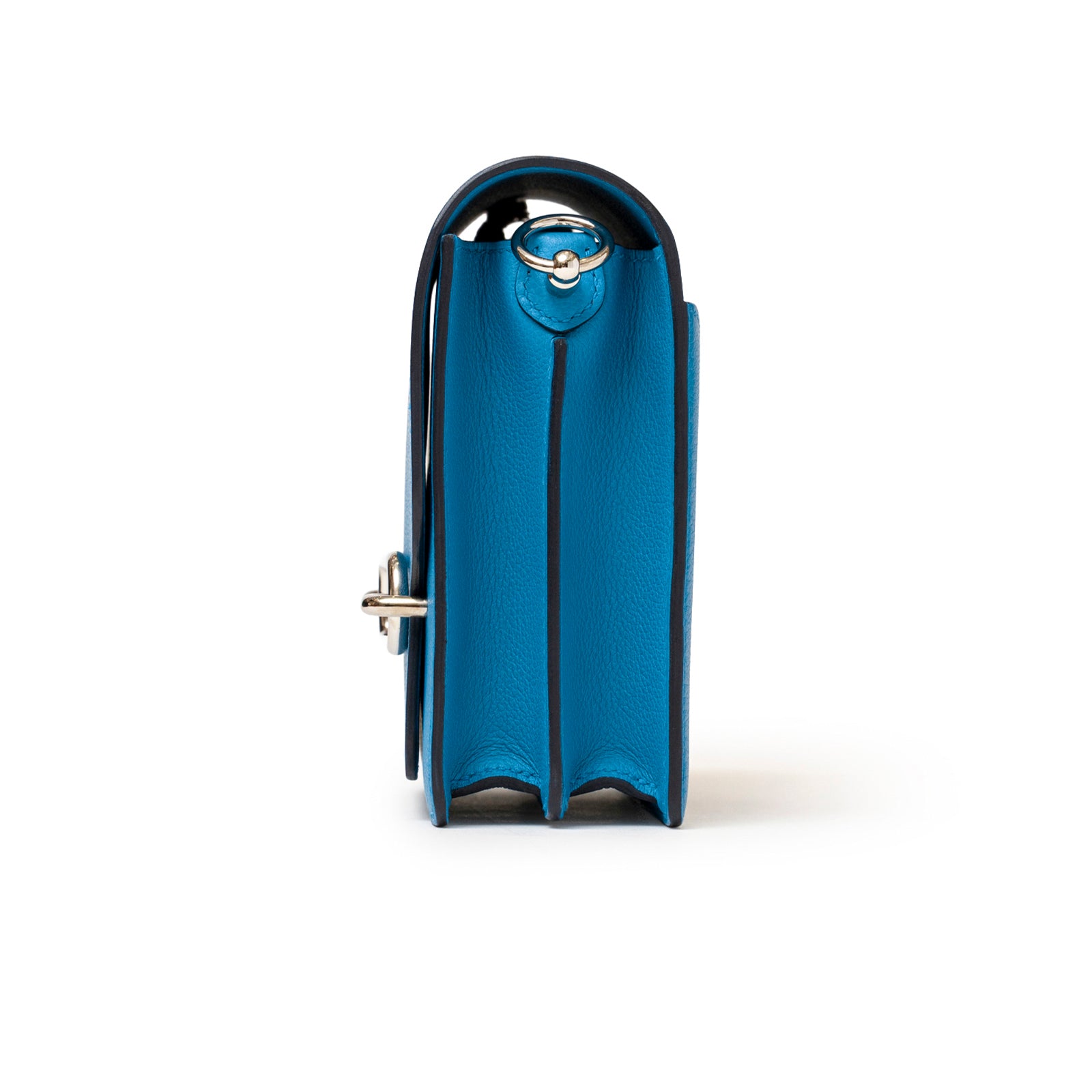 Side view of Hermès Roulis Mini Blue Frida Rouge H Evercolor Palladium Hardware showing structured compartments and smooth leather edges