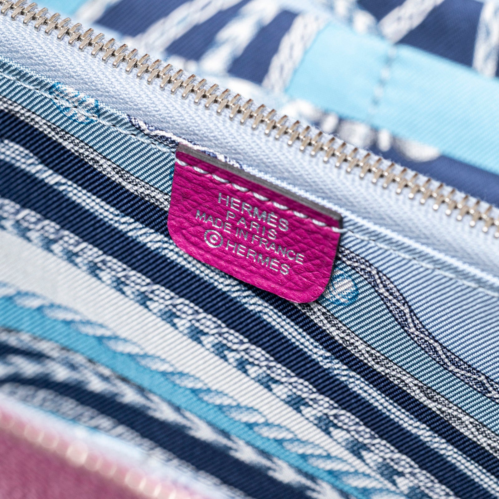 Close-up interior view of Hermès Silk'In Classique Long Wallet Rose Pourpre/Blue Epsom Palladium Hardware showing fabric lining and brand label