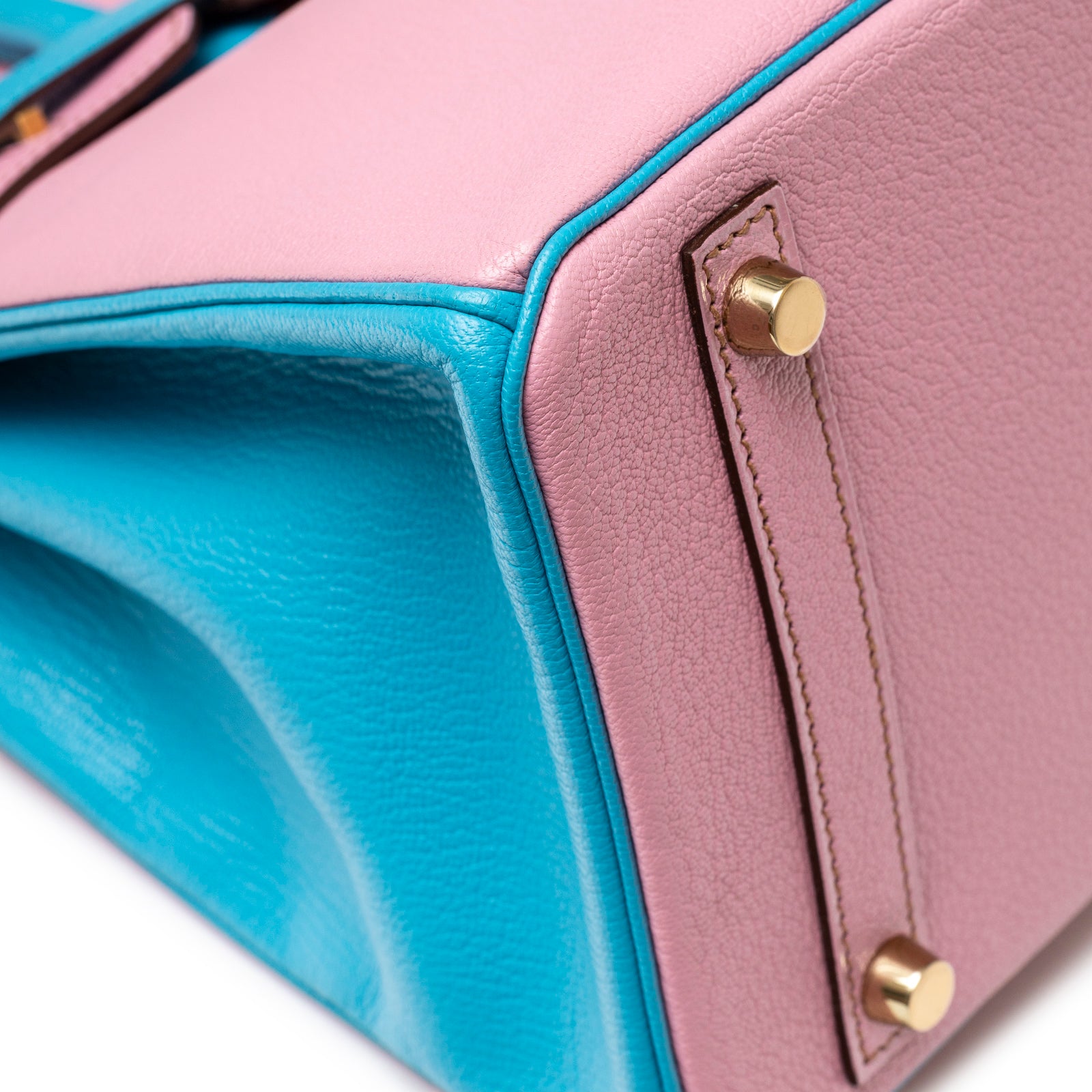 Close-up angled shot of Hermès Special Order HSS Horseshoe Birkin 30 Bubble Gum Pink Celeste Chevre Mysore Brushed Gold Hardware corner and feet
