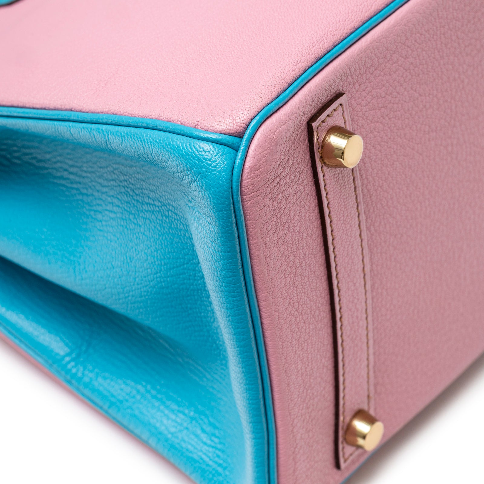 Close-up of Hermès Special Order HSS Horseshoe Birkin 30 Bubble Gum Pink Celeste Chevre Mysore Brushed Gold Hardware corner detail showing leather texture and feet