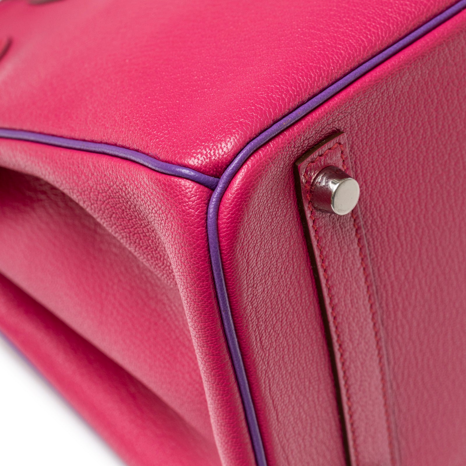Close-up of the bottom corner showing pink leather and palladium hardware on Hermès Special Order HSS Horseshoe Birkin 30 Rose Shocking Parme Chevre Mysore Palladium Hardware