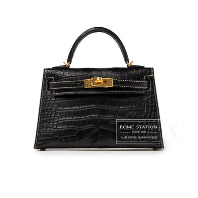 Front view of Hermès Special Order HSS Horseshoe Mini Kelly II Black Gris Matte Alligator Gold Hardware handbag with top handle and gold clasp