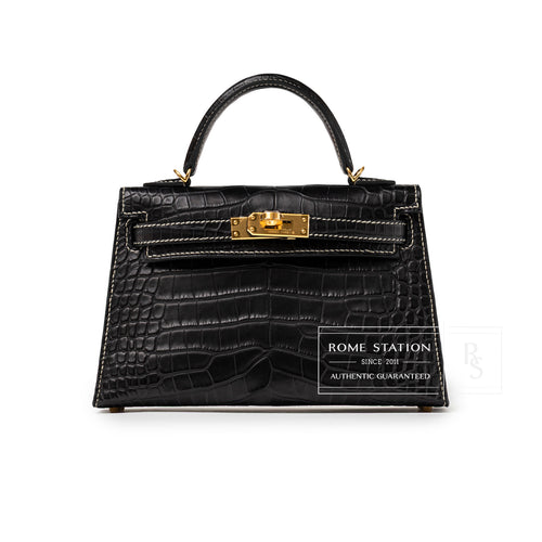 Front view of Hermès Special Order HSS Horseshoe Mini Kelly II Black Gris Matte Alligator Gold Hardware handbag with top handle and gold clasp