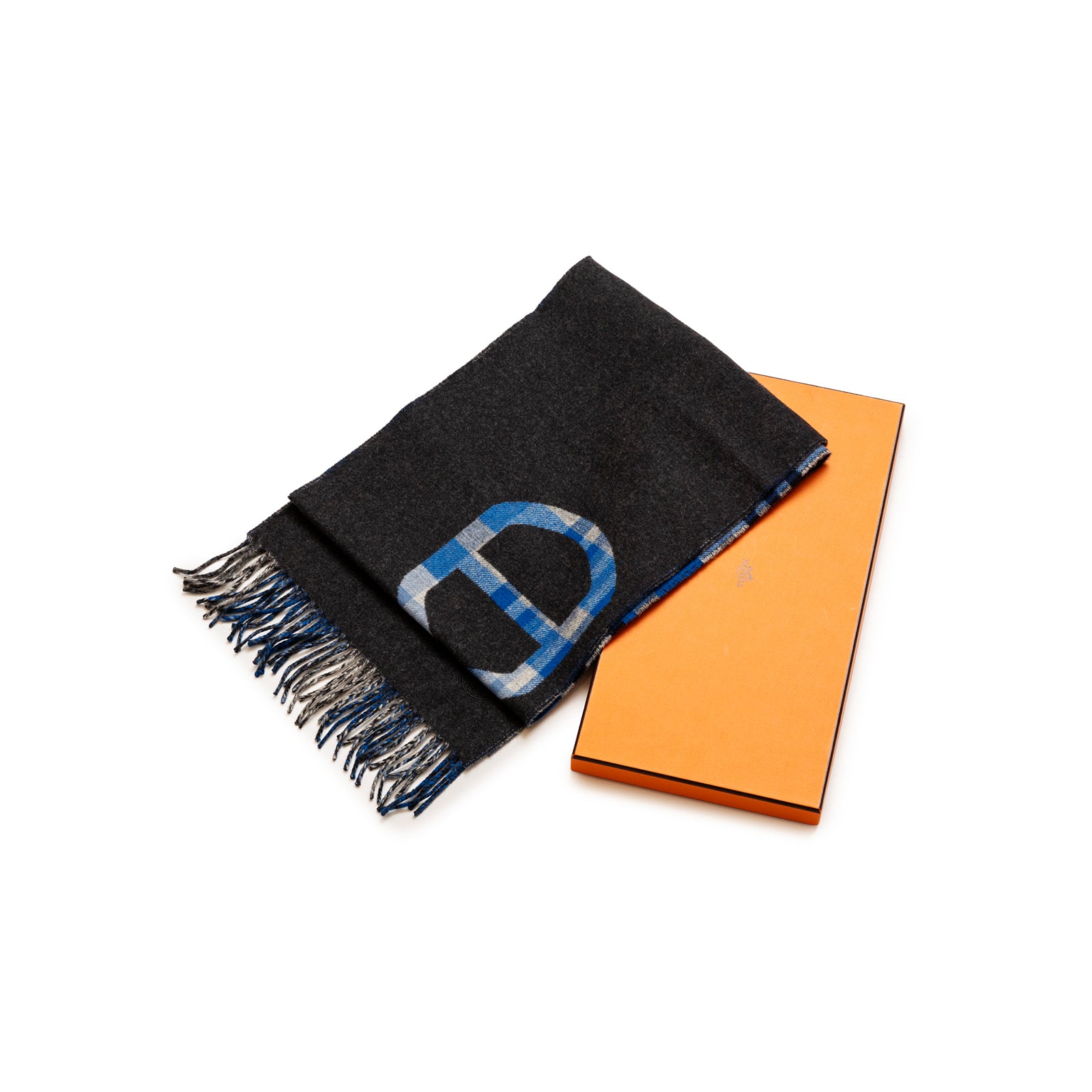 Hermès Tartan Maillons Muffler Cashmere Scarf Anthracite Blue folded showing fringed edges and signature tartan pattern next to orange box