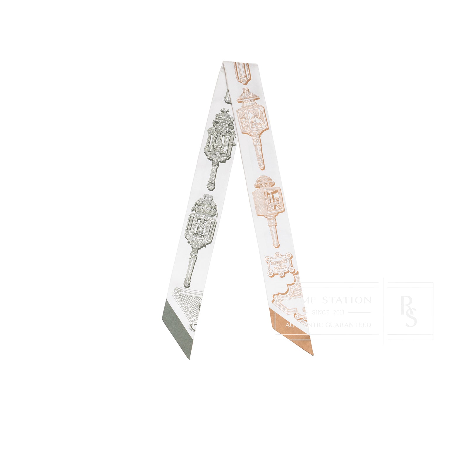 Front view of Hermès Twilly Merveilleuses Lanterne Crème Caramel Kaki showing lantern print on silk fabric