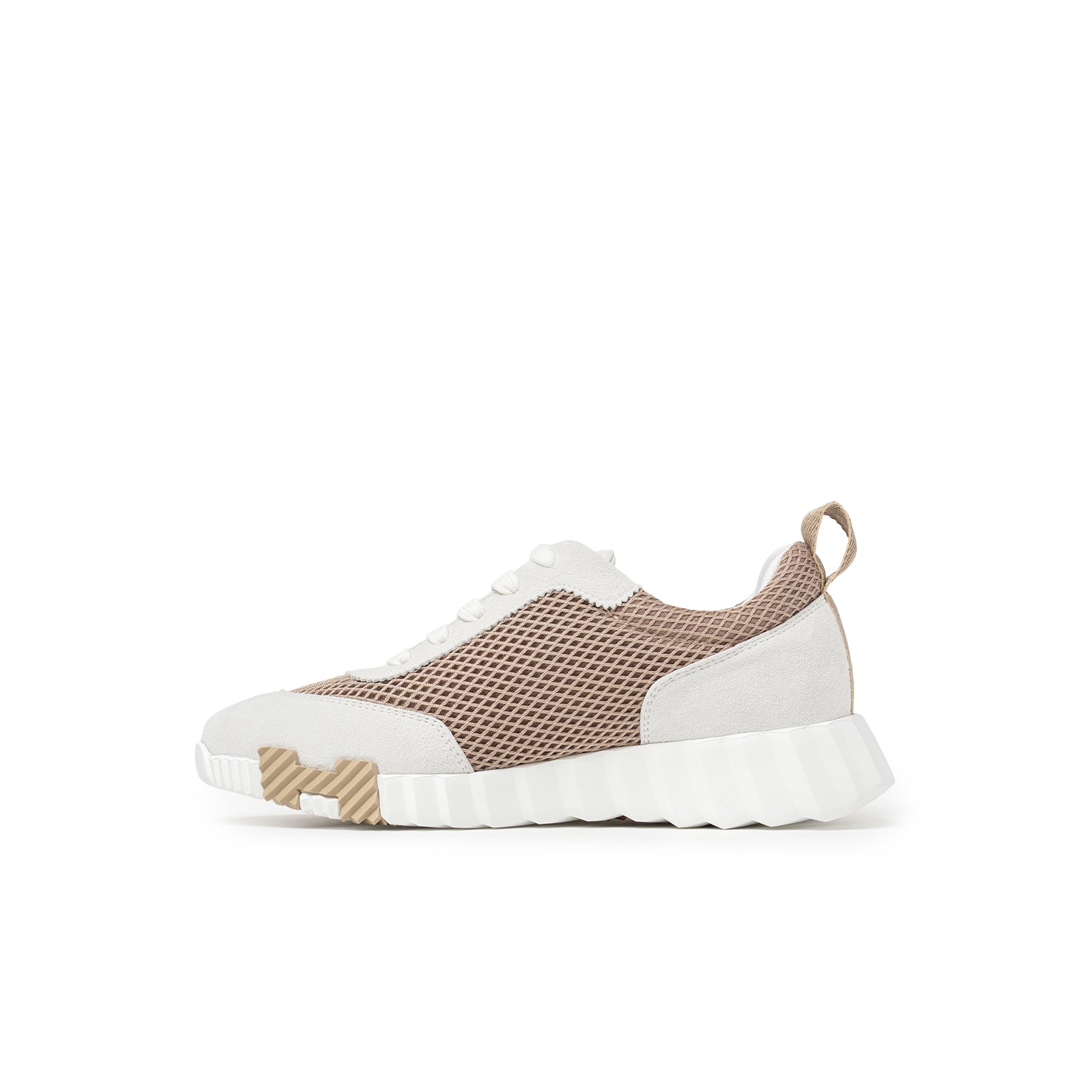 Profile view of Hermès Women's Bouncing Sneaker Beige Argile with mesh panels and textured rubber sole