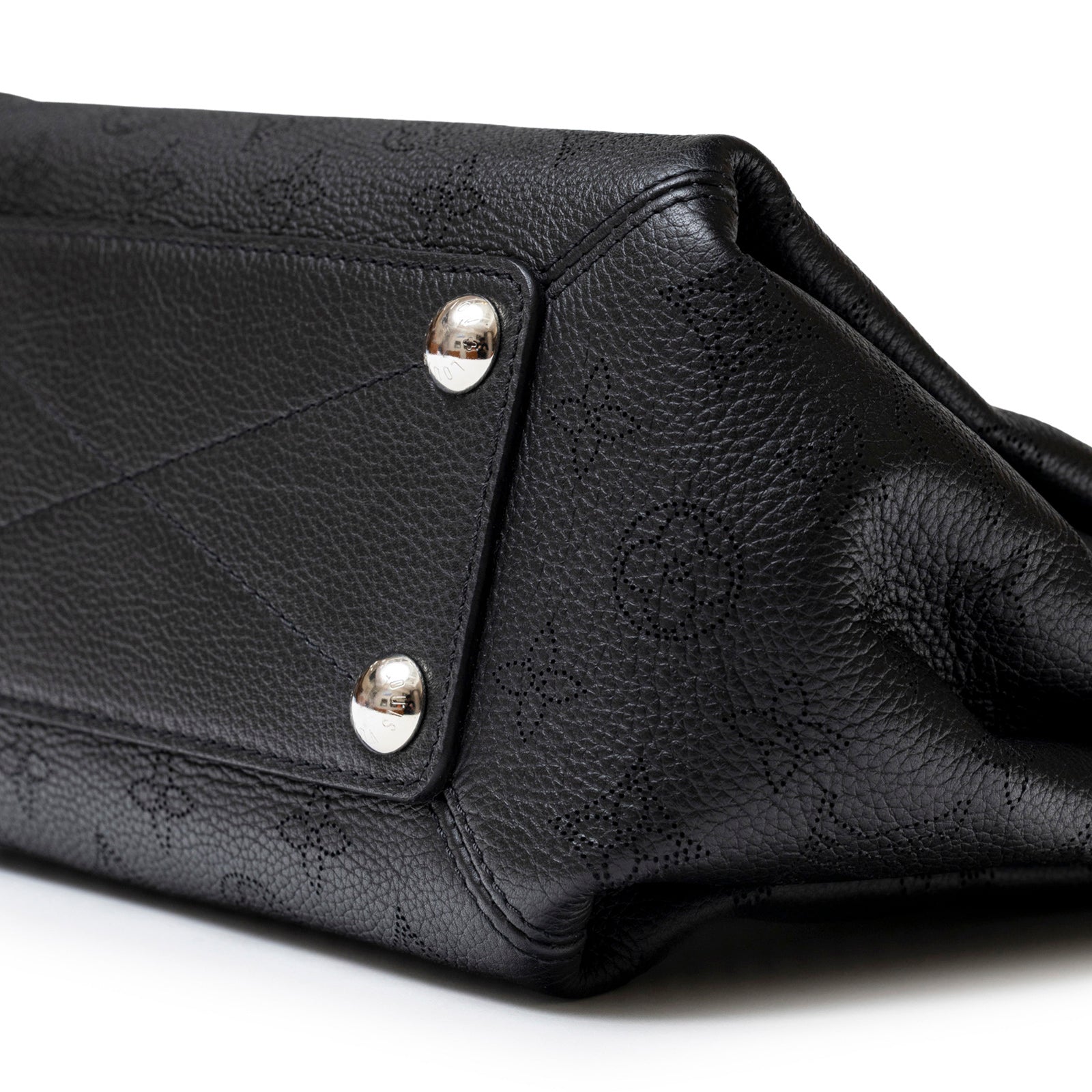 Close-up of bottom corner showing textured leather and metal studs on Louis Vuitton Babylon Chain BB Shoulder Bag Mahina Noir