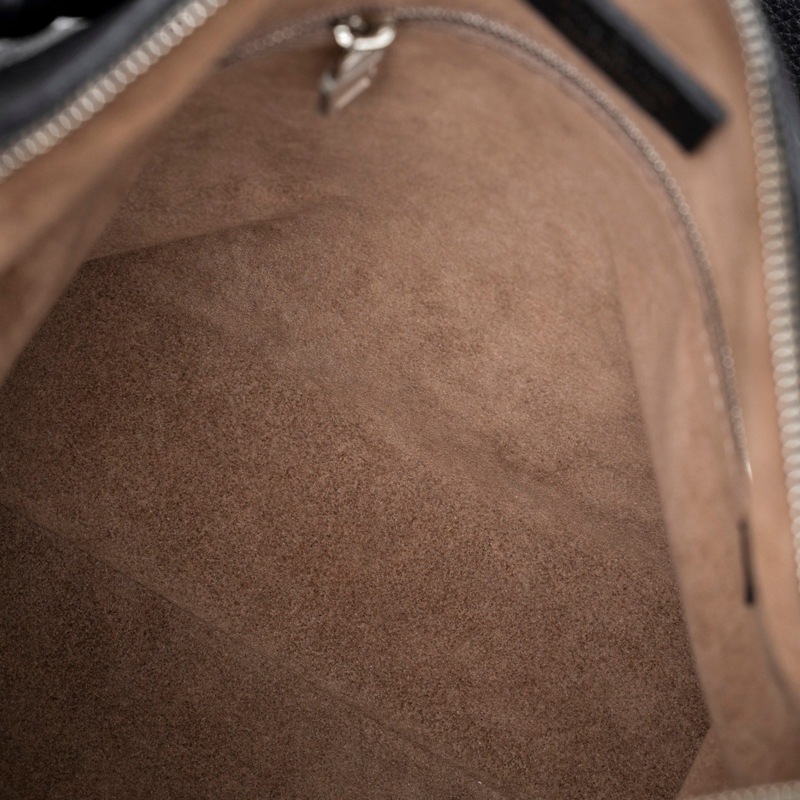 Interior close-up of soft suede lining and zip pocket in Louis Vuitton Babylon Chain BB Shoulder Bag Mahina Noir