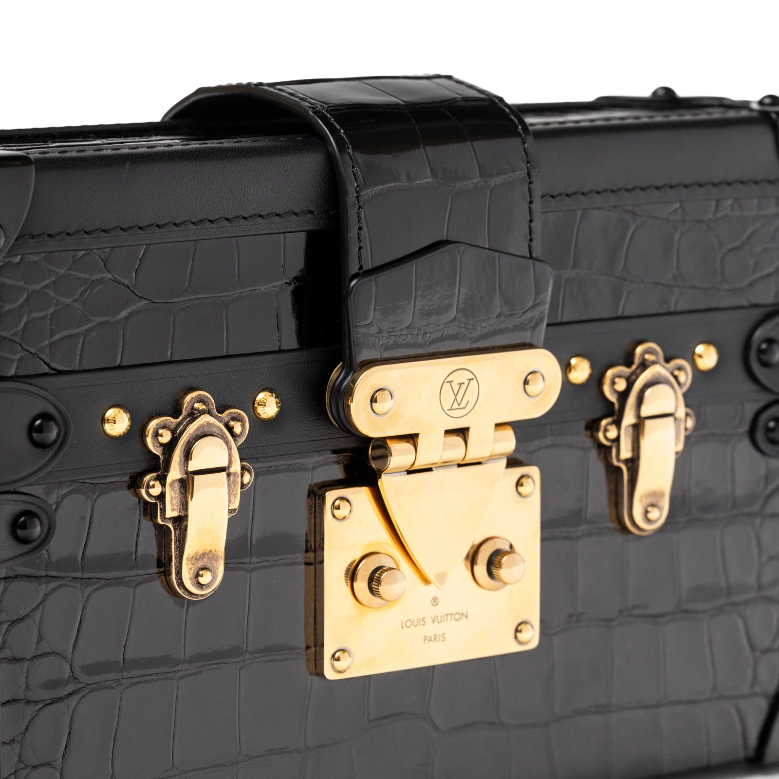 Close-up of Louis Vuitton Petite Malle Black Shiny Niloticus Gold Hardware showing croc embossing and gold clasp detail