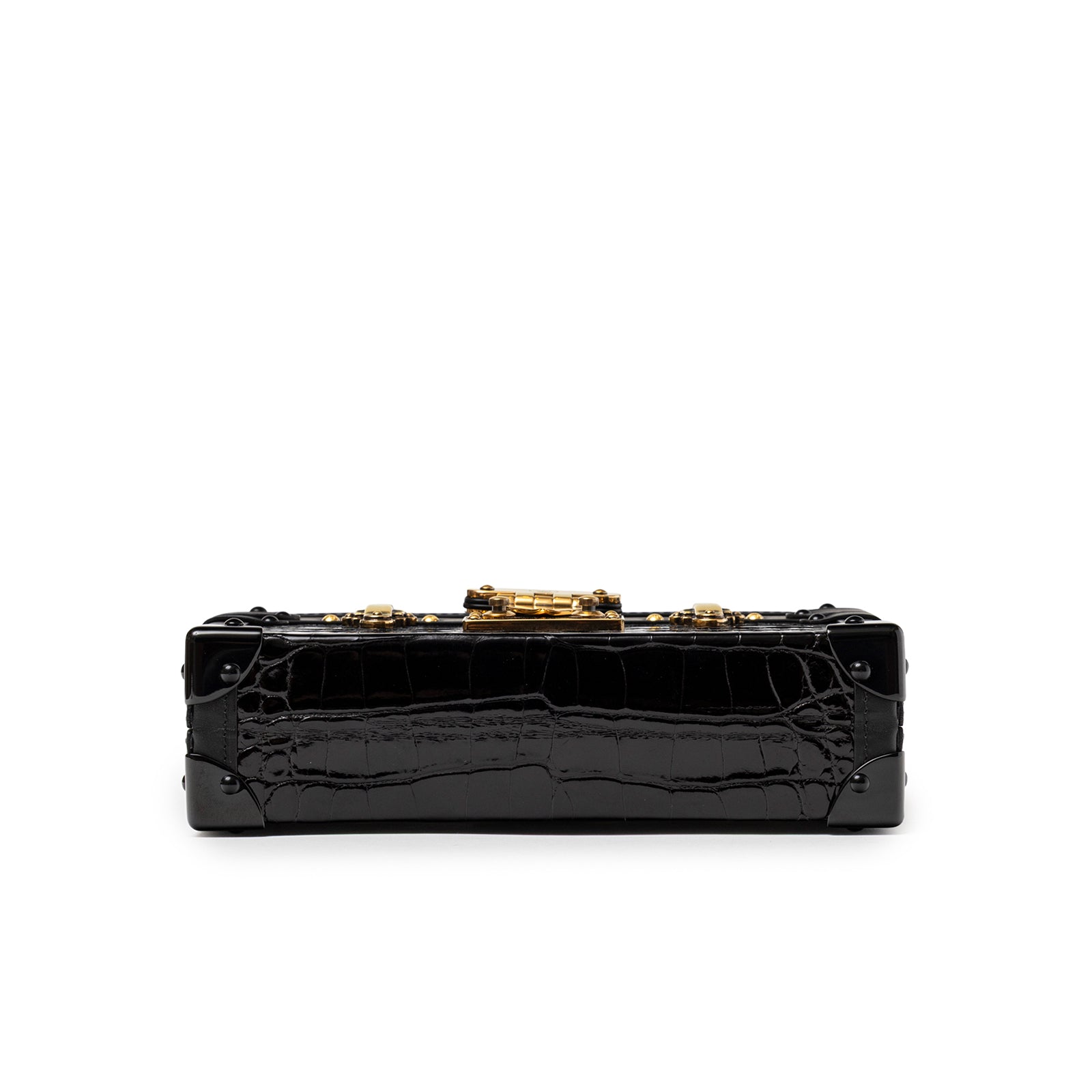 Bottom view of Louis Vuitton Petite Malle Black Shiny Niloticus Gold Hardware showing croc texture and corner detailing