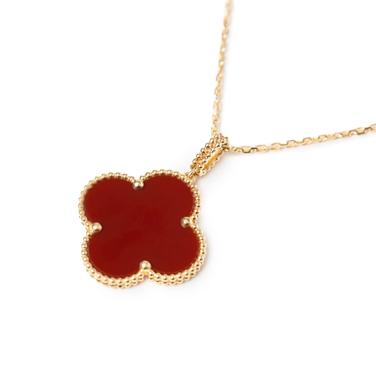 Close-up front view of Van Cleef & Arpels Magic Alhambra 1 Motif Long Necklace 18K Yellow Gold Carnelian pendant