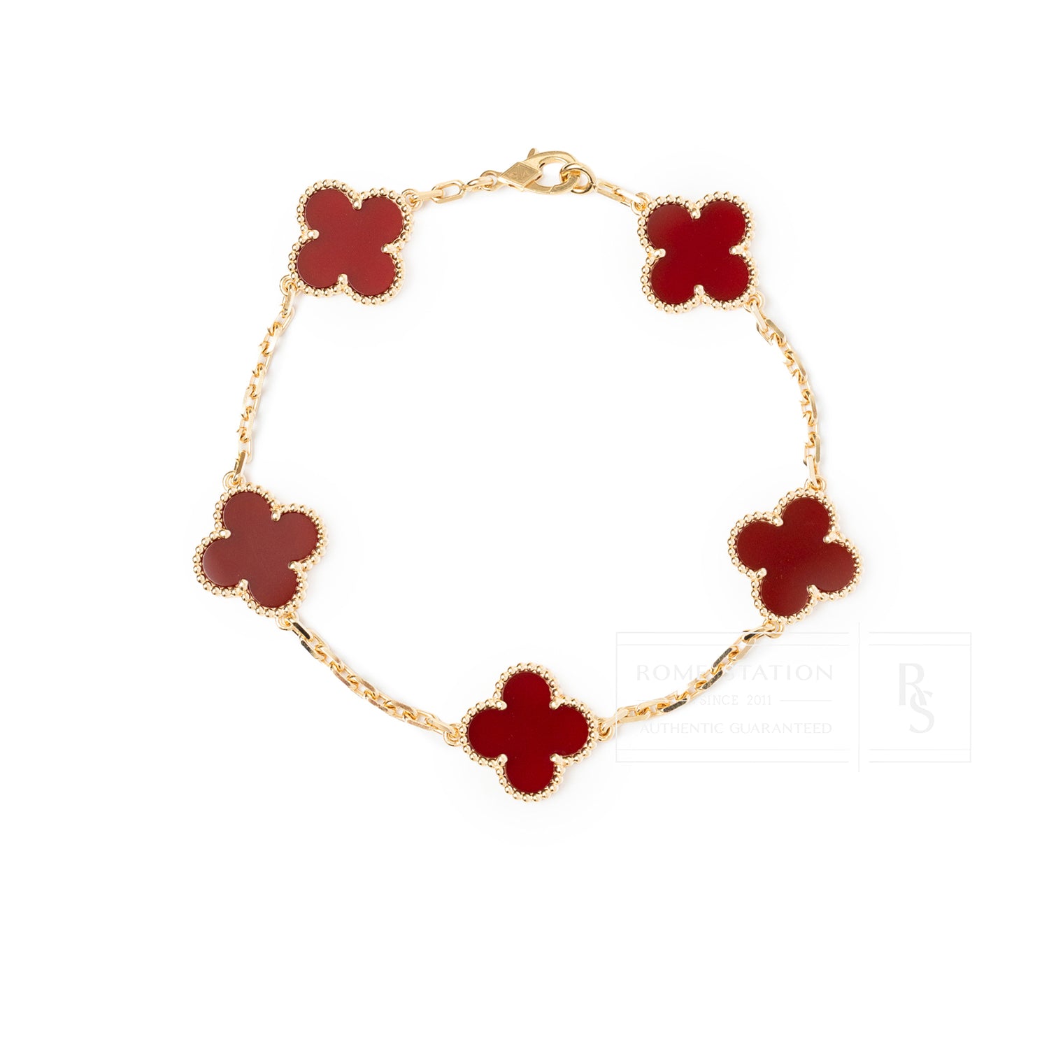 Van Cleef & Arpels Vintage Alhambra 5 motifs Bracelet 18K Yellow Gold Carnelian in top-down view showing red motifs and gold chain links.
