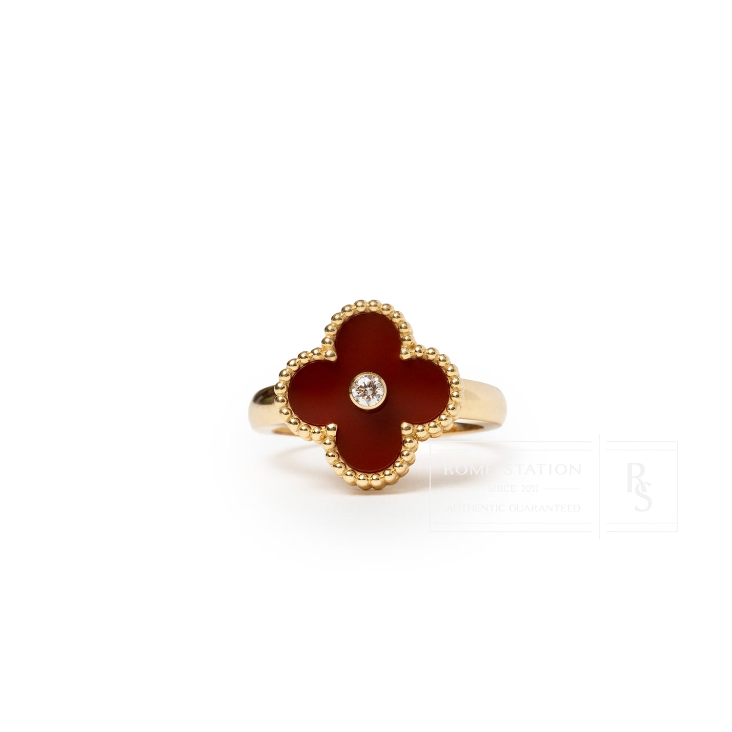 Front view of Van Cleef & Arpels Vintage Alhambra Carnelian Diamond Ring with red carnelian flower and central diamond