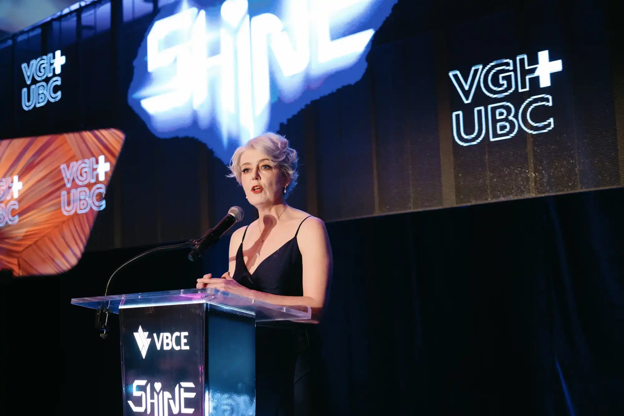 Woman at podium.